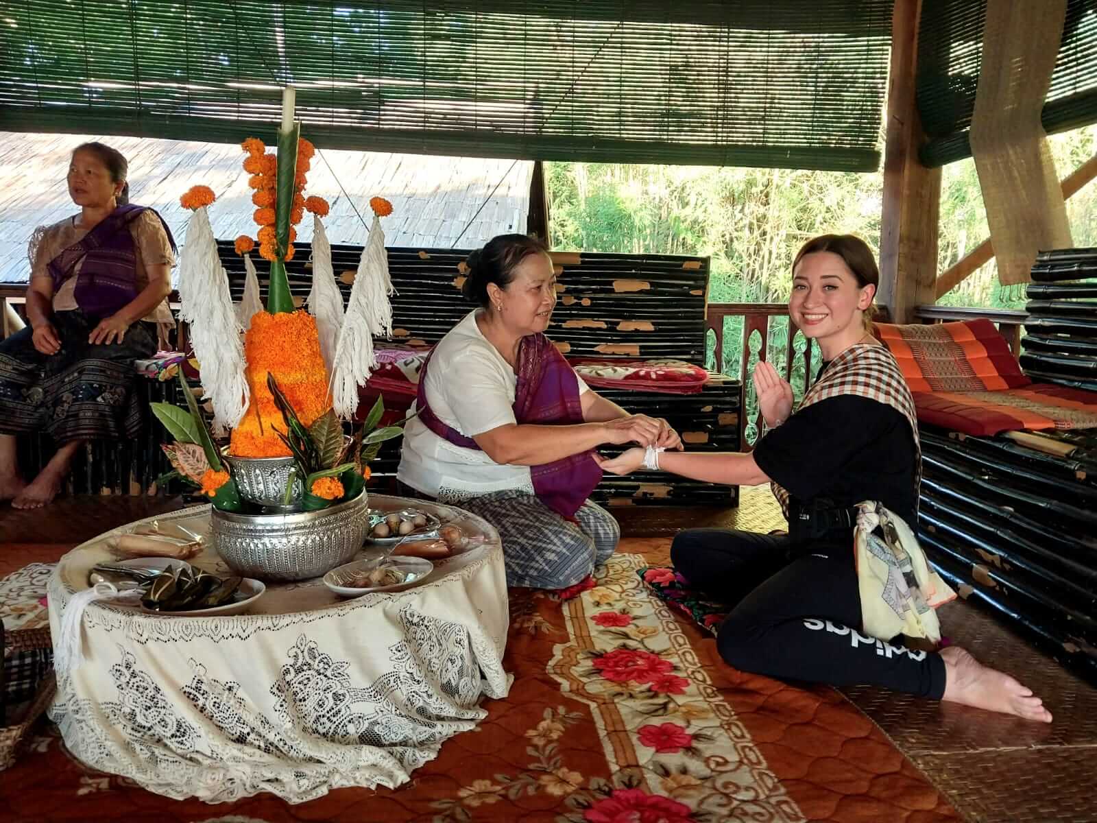 Baci ceremony with villagers in Luang Prabang, Laos.